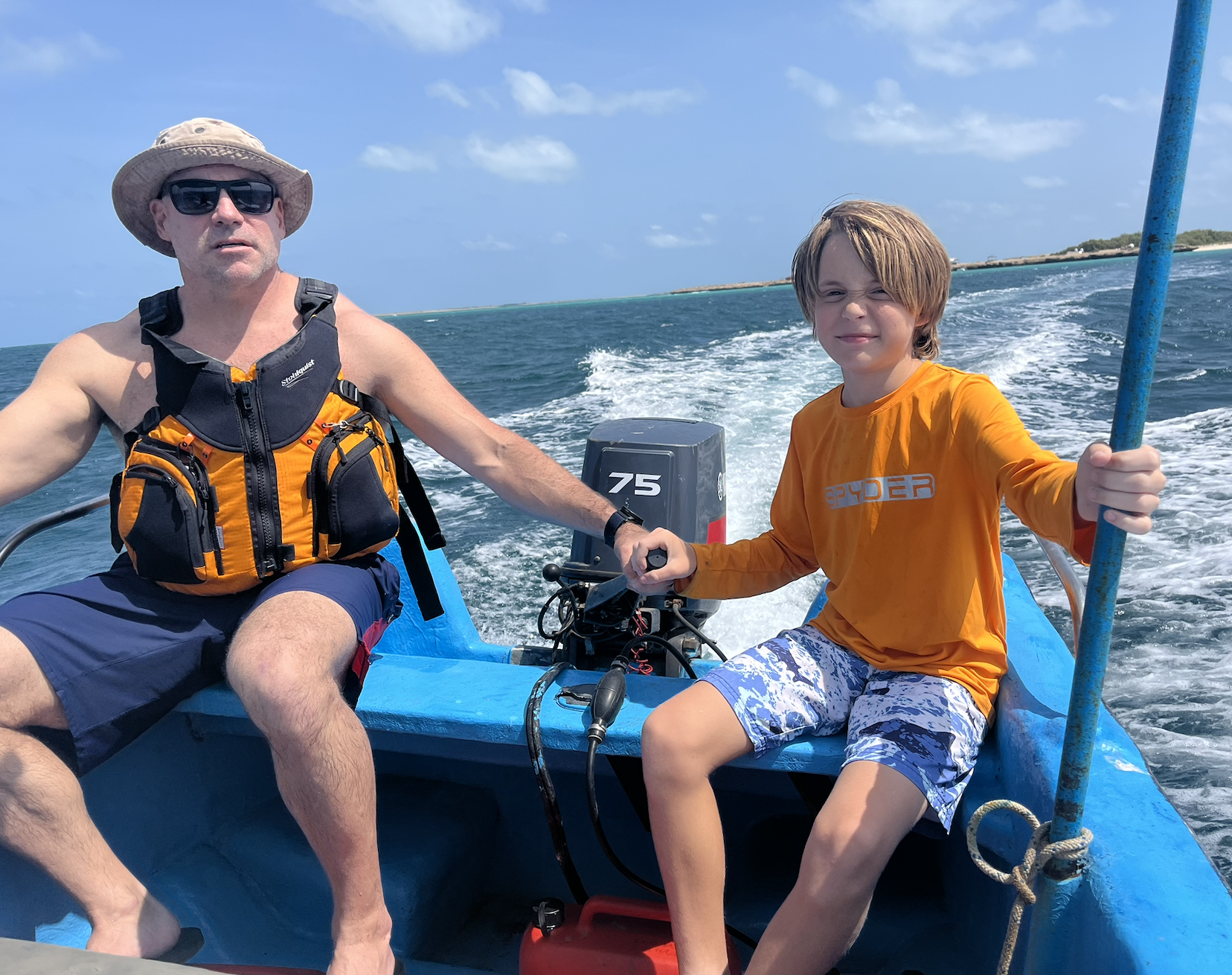 Family on the water during a boating day.